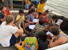 Learning session on the beach with school children facilitated by volunteers